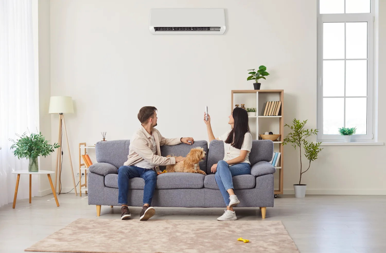 Family relaxing in a cool, comfortable Hunter living room